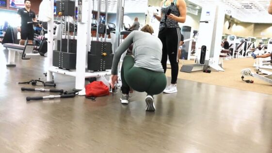 Beautiful Woman with Big Butt Exercising in Green Spandex