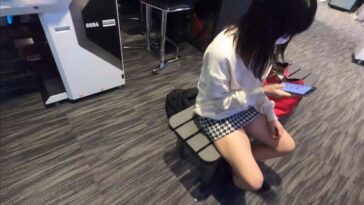 Asian JAV Pcolle Teen Girl Sitting on a Bench in a Miniskirt