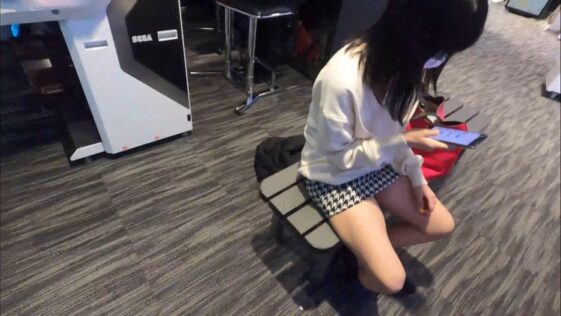 Asian JAV Pcolle Teen Girl Sitting on a Bench in a Miniskirt
